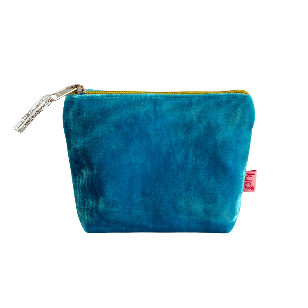 Blue velvet pouch with a gold zipper on a white background
