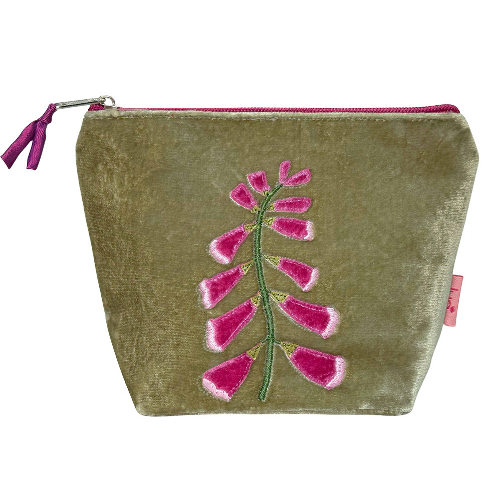 Velvet pouch with pink floral embroidery on a white background