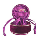 Purple velvet jewelry drawstring pouch with 'lua' brand label on a white background