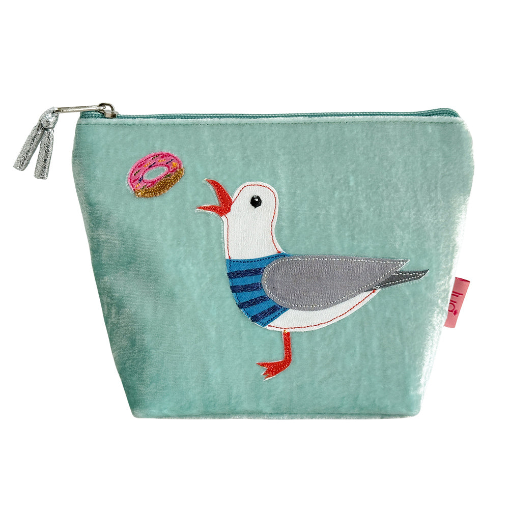 Mint pouch with a seagull design holding a donut on a white background