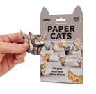 Package of paper cats with a hand holding one, on a white background