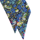 Floral and bird patterned scarf on a white background