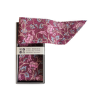 Floral scarf trailing out of grey box. 