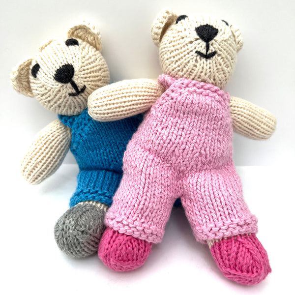 knitted soft toy polar bear in blue dungarees