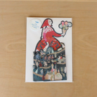 Greeting card with die-cut design on a wooden surface