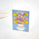 Card with a floral design on a blue background