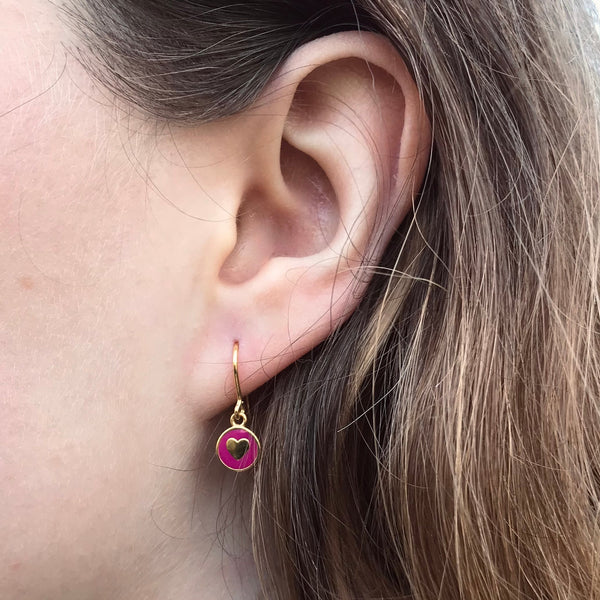 cherry heart earring in ear 