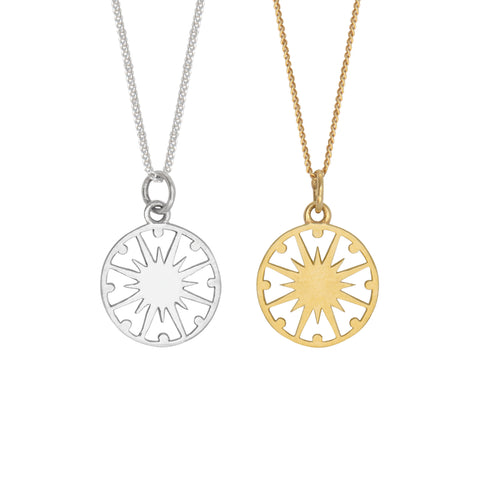 supernova token necklaces in gold and silver 