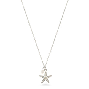 starfish and pearl necklace on white background 